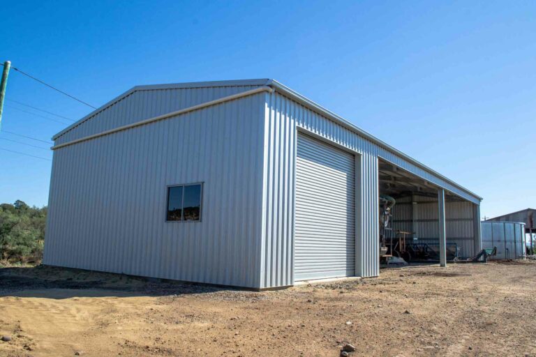 Farm Shed for machinery storage and chemical storage with a lockable bay, secured by a roller door.