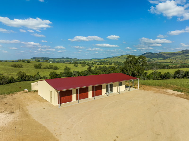 Multi-purpose acreage shed in the Lockyer Valley with lock-up garages, glass sliding doors and open car access
