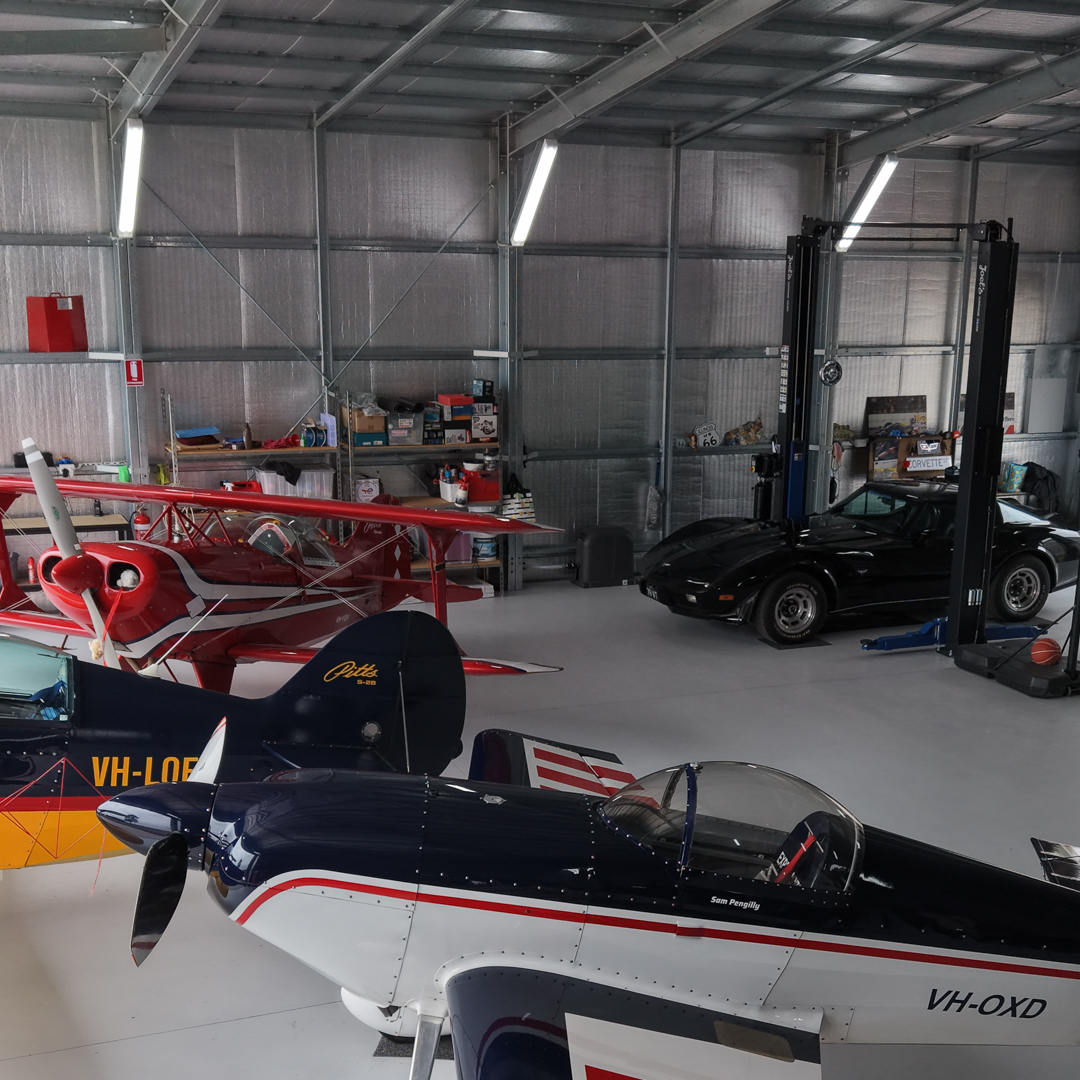 Aircraft hangar insulation to the roof, walls and custom sliding doors.