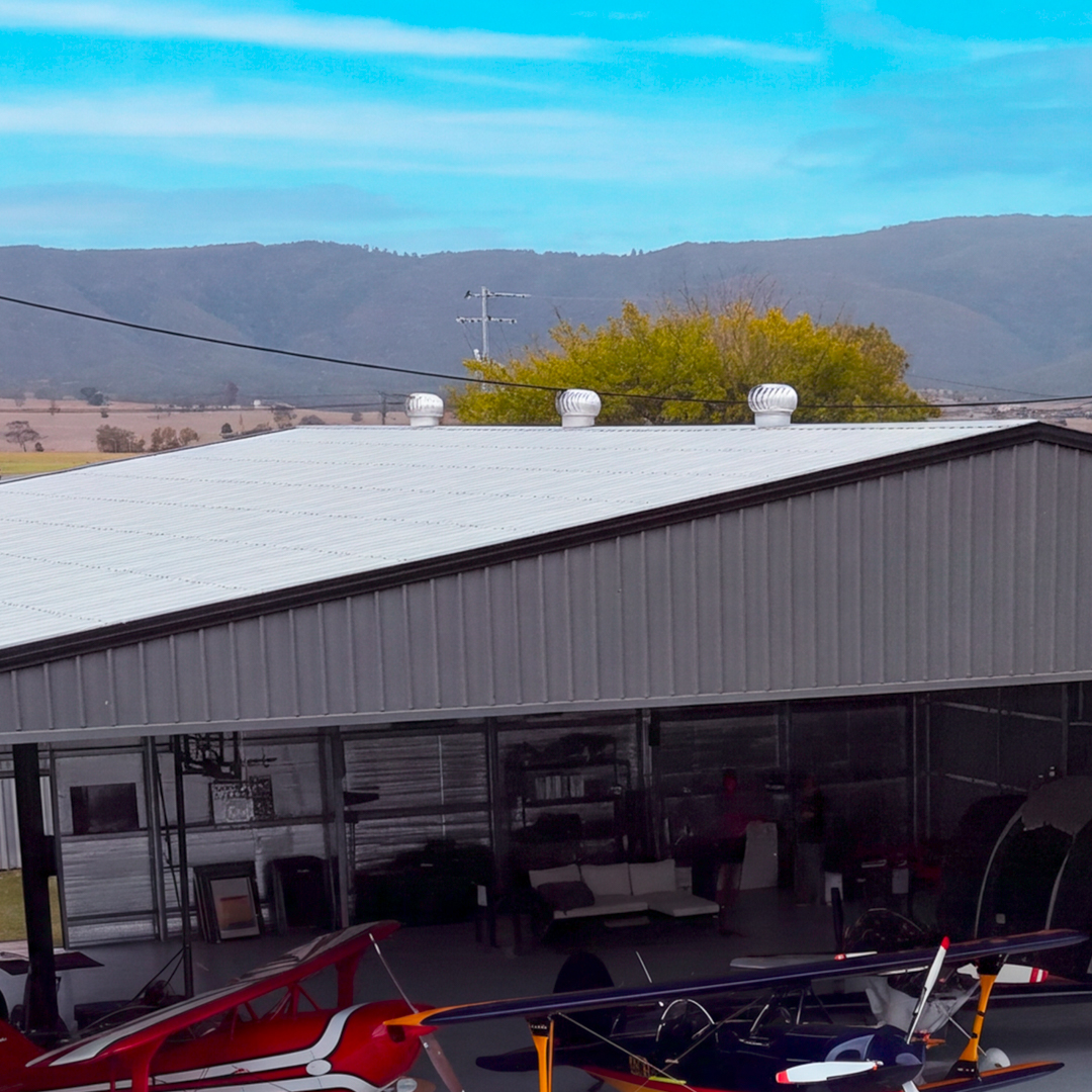 Custom Aircraft Hangar with Whirlybirds for Natural Ventilation