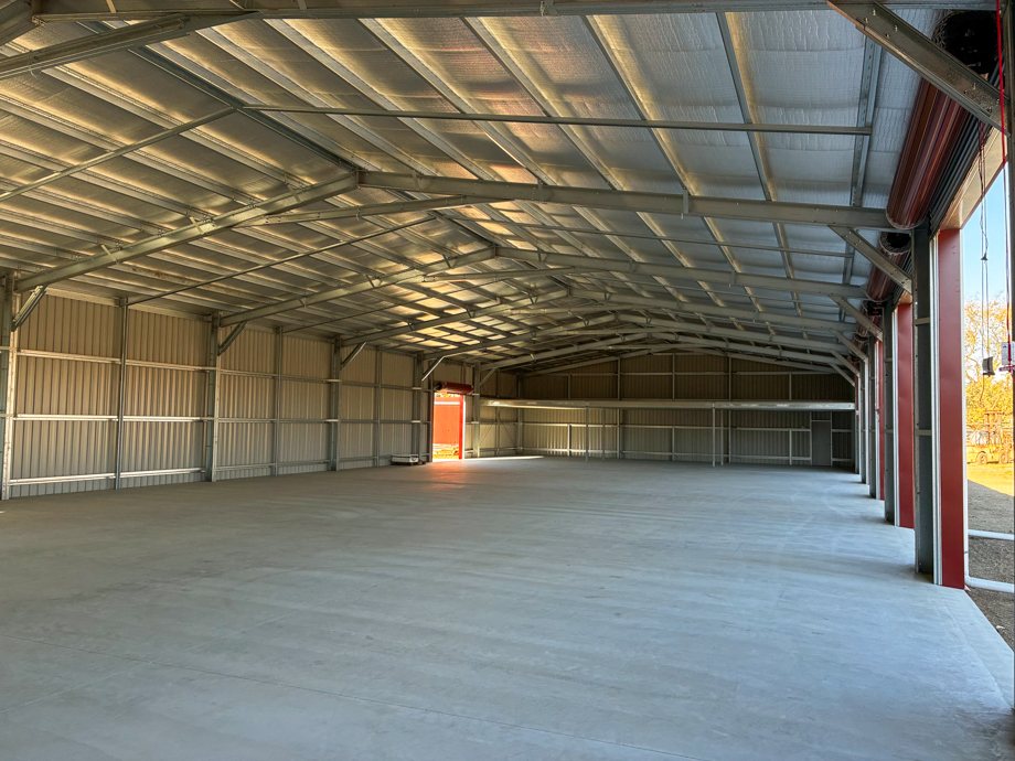 Custom shed interior with multiple roller doors, mezzanine floor and drive-through bay