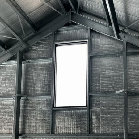 Close up of custom window in the gable of two-bay garage