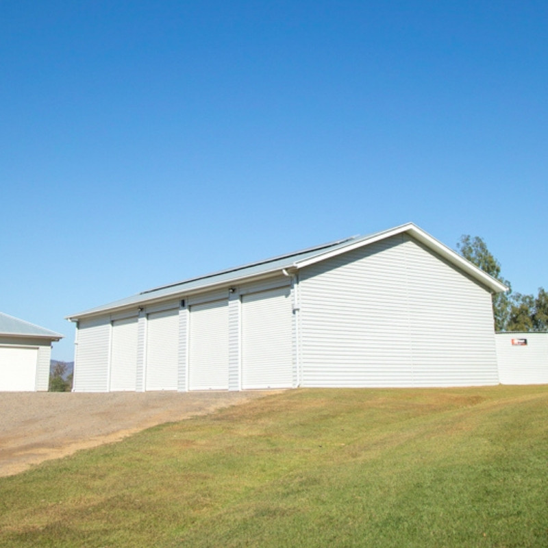 Custom acreage shed in Flagstone Creek with cladding selected to complement the existing house
