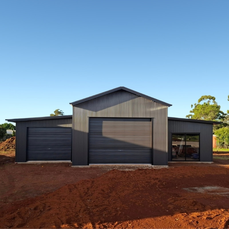 Custom American Barn Style Shed with overhangs and different roof lines.