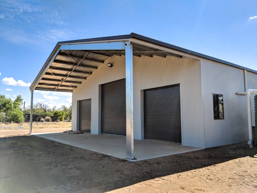 Three bay garage with front awning.