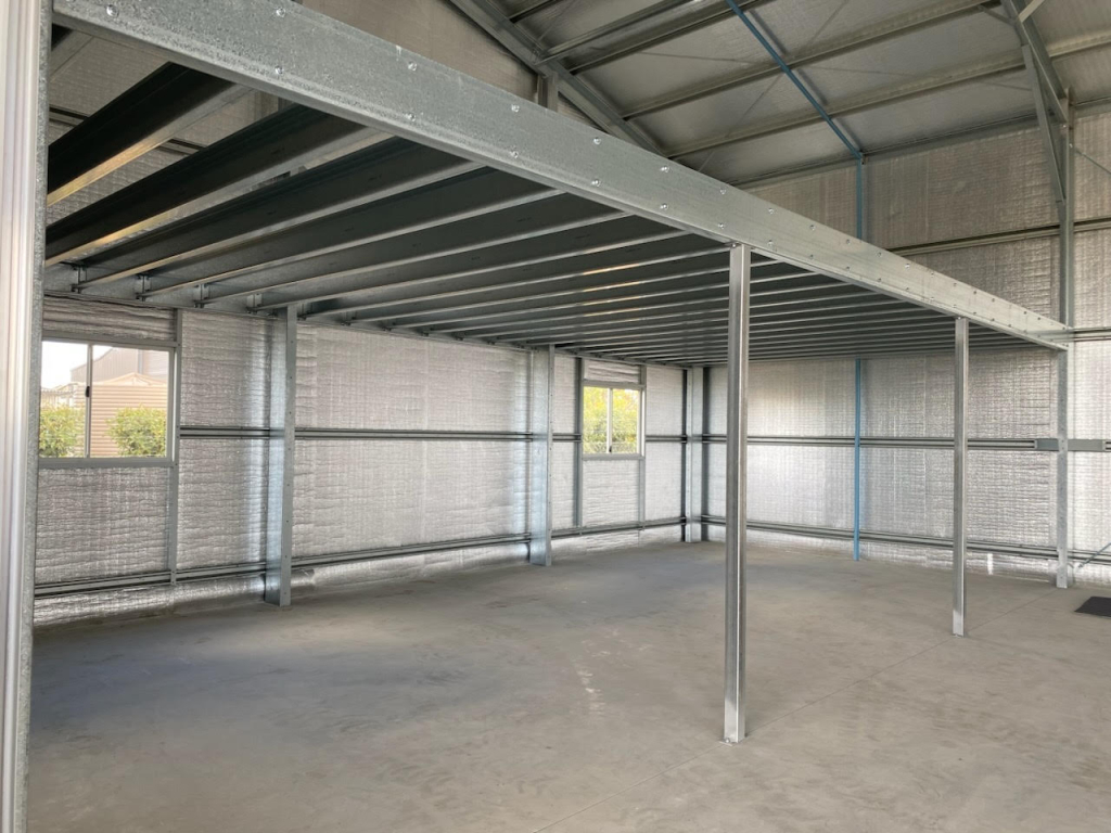 Residential shed mezzanine under construction with steel posts and bearers installed