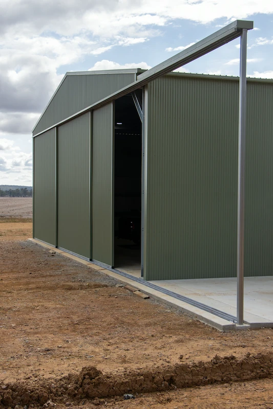 Steel sliding doors on the enclosed section of the farm shed