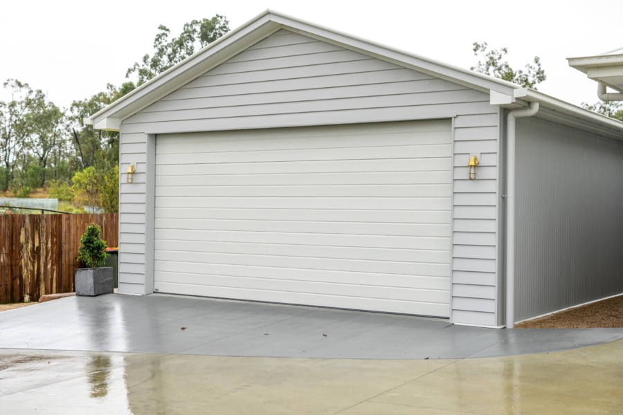 Exterior view of the roller door on a custom residential shed in Brisbane West