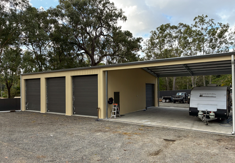 Caravan parked in the large gable extension of a custom shed in Karalee, Brisbane